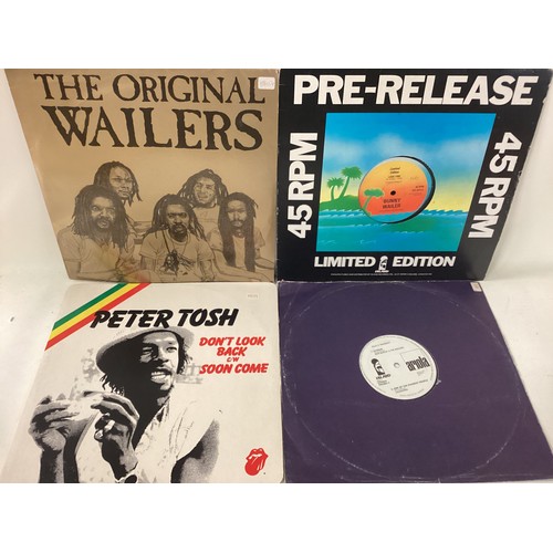 118 - COLLECTION OF REGGAE RELATED VINYL RECORDS. These records include artists - Peter Tosh - Bob Marley ... 