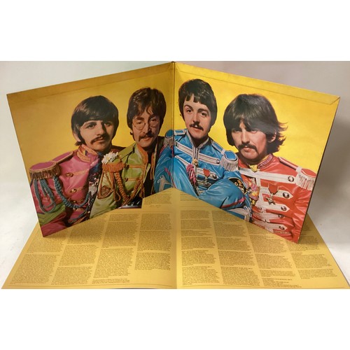 73 - BEATLES VINYL LP RECORDS X 2. Here we find a copy of ‘Sgt Pepper’s Lonely Hearts Club Band’ on Parlo... 