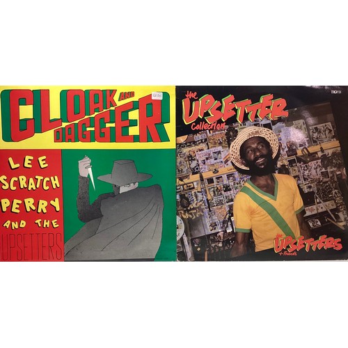 48 - LEE SCRATCH PERRY AND THE UPSETTERS VINYL ALBUMS X 2. Here we have ‘Cloak And Dagger’ (Red cover) on... 