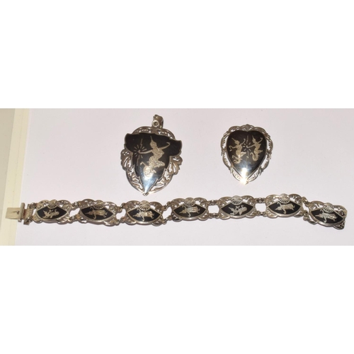 307 - Siamese silver bracelet pendant and brooch