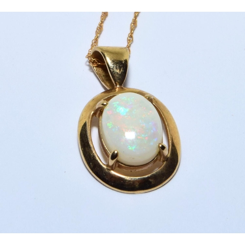 329 - 9ct gold Opal pendant necklace in a claw setting with a chain of 46cm