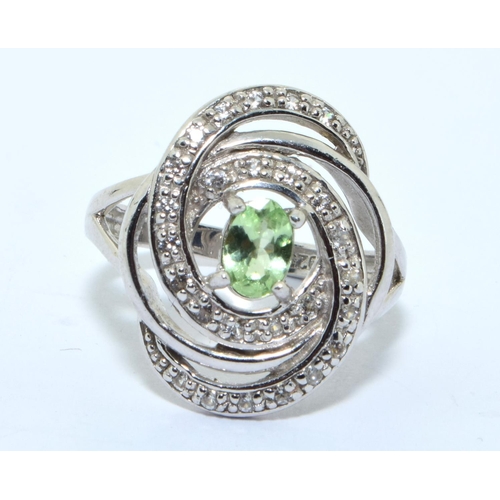 334 - A 925 silver and peridot swirl ring size M