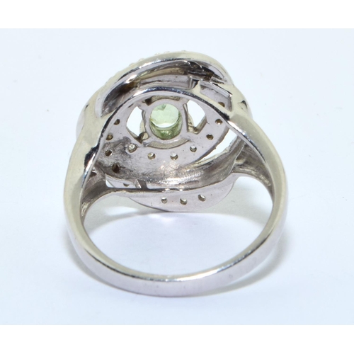 334 - A 925 silver and peridot swirl ring size M