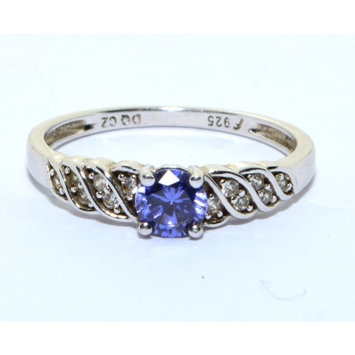 344 - A 925 silver, CZ and tanzanite ring Size R