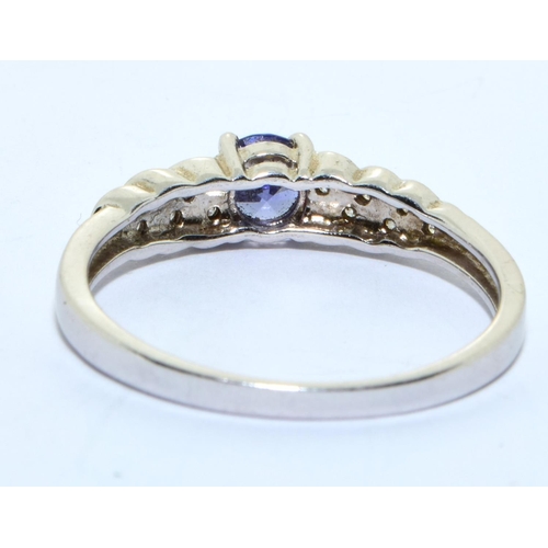 344 - A 925 silver, CZ and tanzanite ring Size R