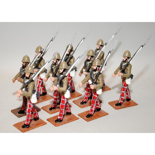 188 - Britain's die-cast figures: late 19thC 72nd Highland Infantry marching in khaki blouse and trews. 10... 