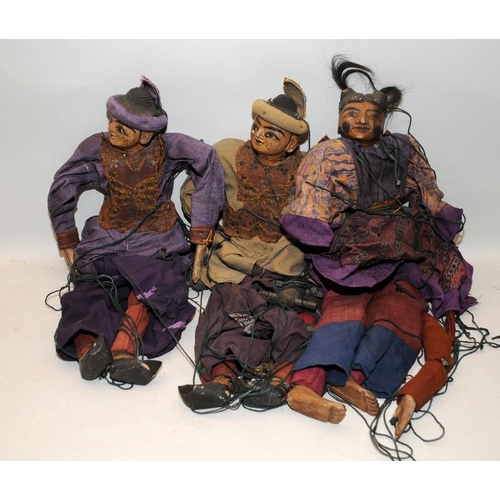 278 - Three vintage Eastern puppets with terracotta heads and limbs wearing traditional dress. Approx 48cm... 