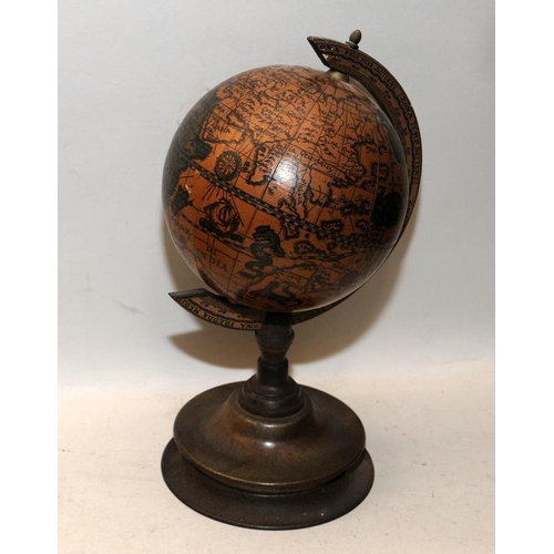 34 - Reproduction of an antique terrestrial globe on wooden stand. 28cms tall