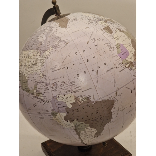 5 - Large rotating globe of the world on wooden base 48cm tall.