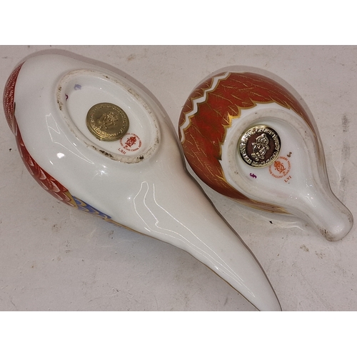 81 - Two Royal Crown Derby paperweights to include Pheasant and Sparrow. Both with gold stoppers unboxed.