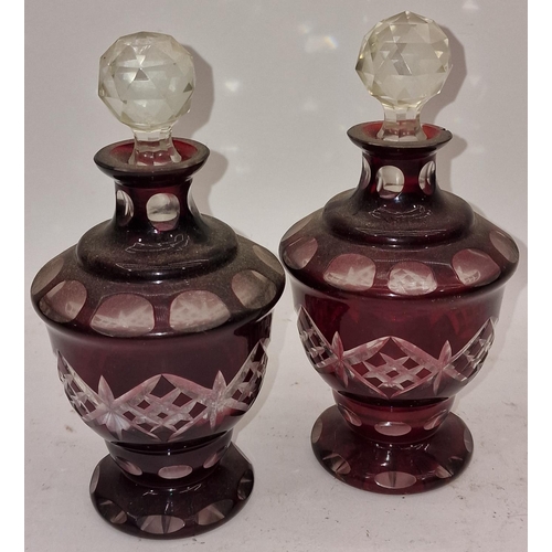 38 - Pair of Bohemian vintage ruby red bottles with toppers together with a Mdina coloured glass vase (3)... 