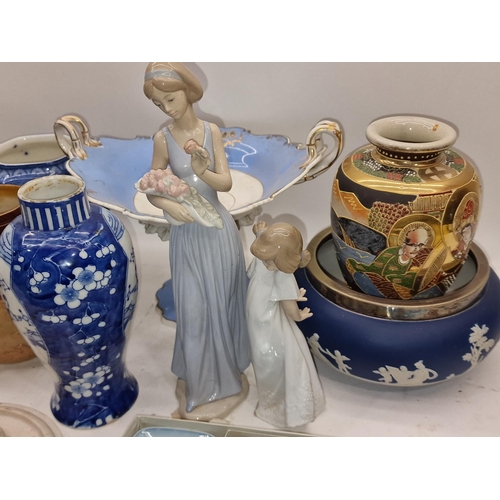 63 - Collection of chinaware items to include Oriental pieces, two Nao figures and other items.