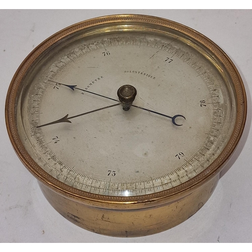 94 - Victorian brass cased Aneroid barometer 13cm across.