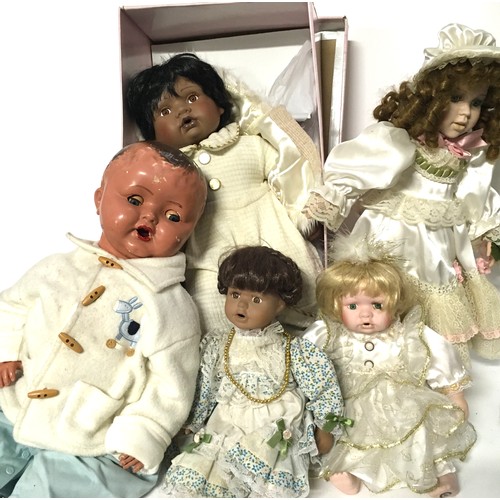 12 - Childs collectable Silver Cross dolls pram together with 5 bisque headed dolls to include a boxed Le... 