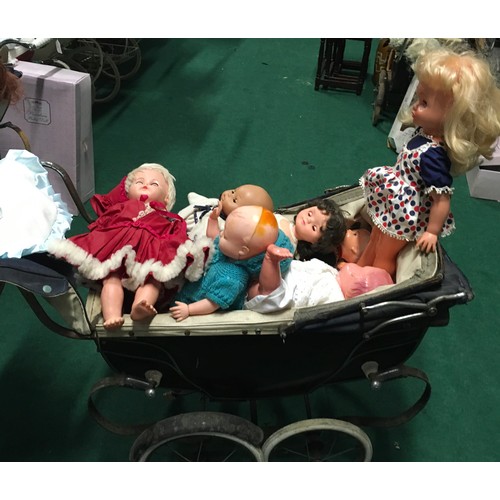 20 - Childs collectable Silver Cross dolls pram together with a collection of baby dolls