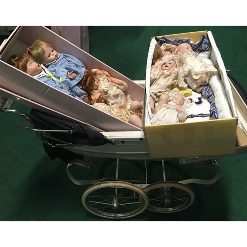 17 - Childs collectable Silver Cross double dolls pram together with 8 bisque headed  Baby dolls