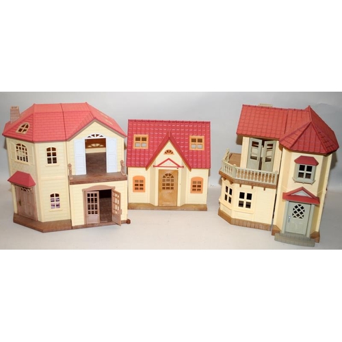 24 - A collection of Sylvanian Families houses and out buildings