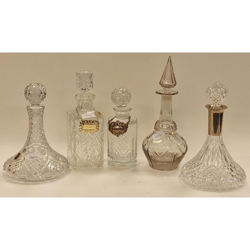 84 - Collection of five miscellaneous crystal glass decanters to include ships decanters. All include sto... 