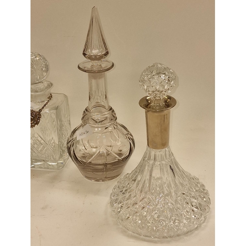 84 - Collection of five miscellaneous crystal glass decanters to include ships decanters. All include sto... 