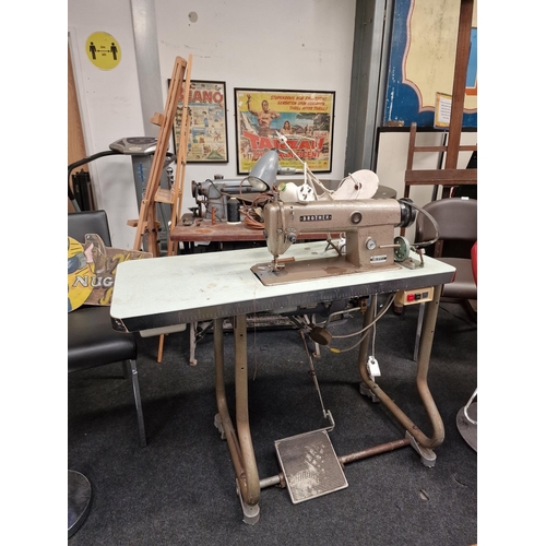 418 - A vintage Brother sewing machine and table.