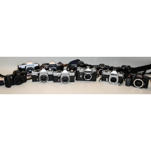 57 - A collection of vintage 35mm film SLR cameras to include Minolta, Canon Zenit etc. 11 in lot