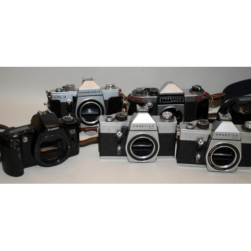 57 - A collection of vintage 35mm film SLR cameras to include Minolta, Canon Zenit etc. 11 in lot