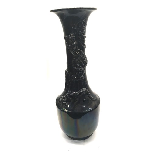 12 - A large19th century black glazed oriental dragon vase.