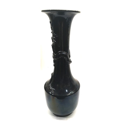 12 - A large19th century black glazed oriental dragon vase.