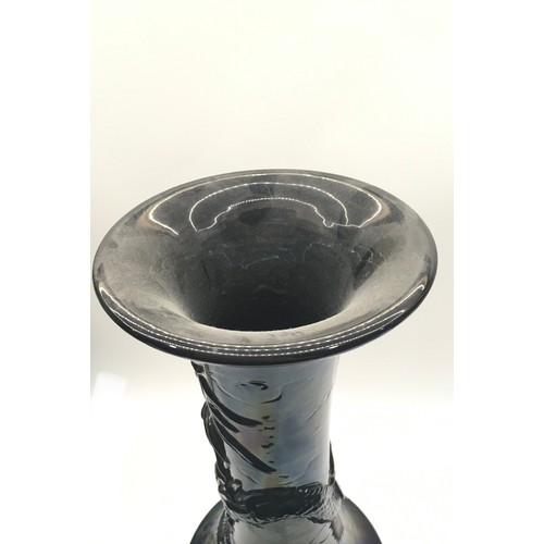 12 - A large19th century black glazed oriental dragon vase.