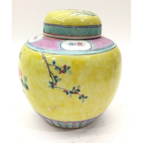 49 - A Chinese yellow jar and lid. 15x12cm