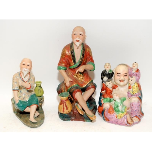 50 - A collection of nine Chinese ceramic figures to include tradesman, buddhas, gilt foo lion and hooded... 