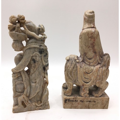 59 - Two Oriental deep carved 19/20 century soap stone carved figures. 29cm tall