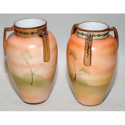 23 - A pair of small Noritake hand painted vases. 13cms tall