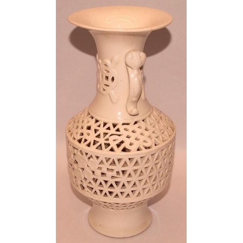 53 - Oriental Blanc de Chine vase with pierced lattice and foliate decoration. 21cms tall