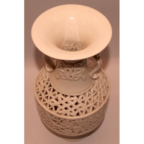 53 - Oriental Blanc de Chine vase with pierced lattice and foliate decoration. 21cms tall