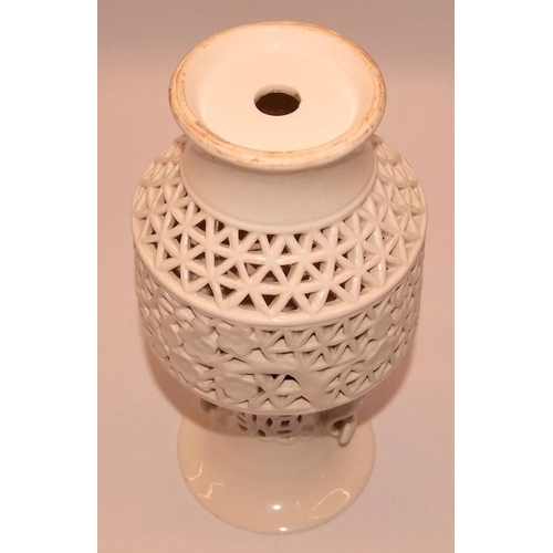 53 - Oriental Blanc de Chine vase with pierced lattice and foliate decoration. 21cms tall