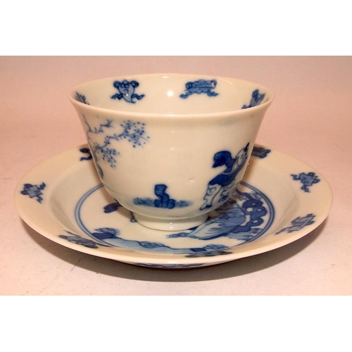 40A - !9th Century or later Oriental blue and white cup and saucer depicting a mother with child and addit... 