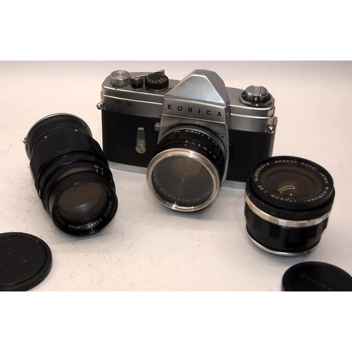 54 - Scarce Konica FS 35mm film SLR camera c/w 28mm 50mm and 135mm lenses. Only produced for a couple of ... 