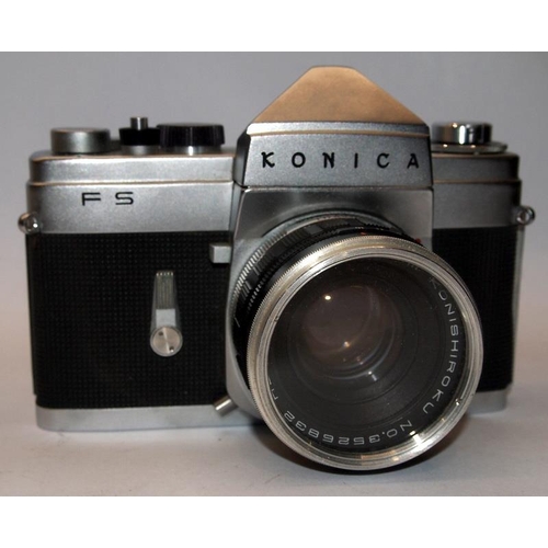 54 - Scarce Konica FS 35mm film SLR camera c/w 28mm 50mm and 135mm lenses. Only produced for a couple of ... 