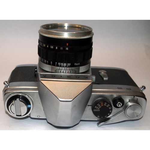 54 - Scarce Konica FS 35mm film SLR camera c/w 28mm 50mm and 135mm lenses. Only produced for a couple of ... 