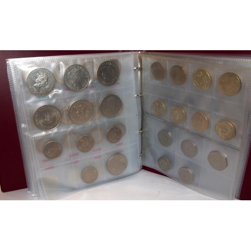 198 - Coin album containing a very large number of GB 50p, £2 and £5 coins, includes the rare 2009 Kew Gar... 