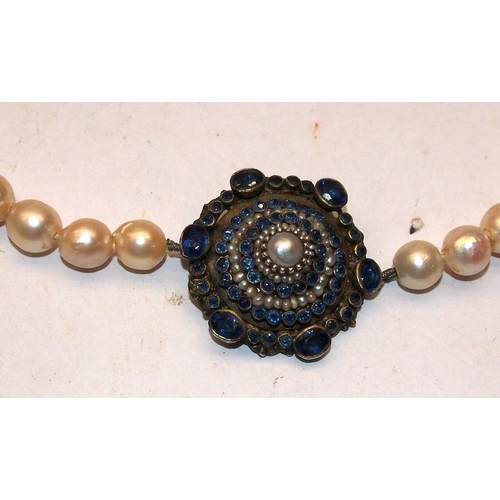 357 - Pearl necklace with a ornate jewelled silver clasp