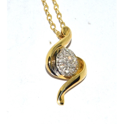 386 - 9ct gold Diamond pendant necklace in a clef design with diamonds in the center set on a 40cm gold ne... 