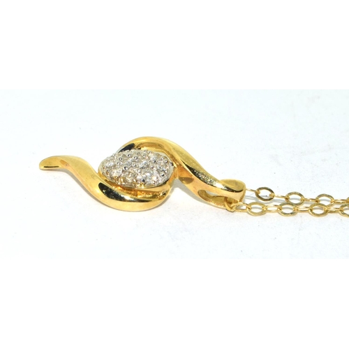 386 - 9ct gold Diamond pendant necklace in a clef design with diamonds in the center set on a 40cm gold ne... 