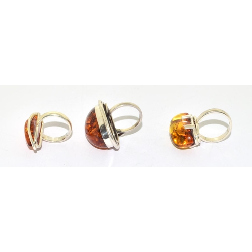 244 - 3 good silver Amber statement rings sizes O, P, and S