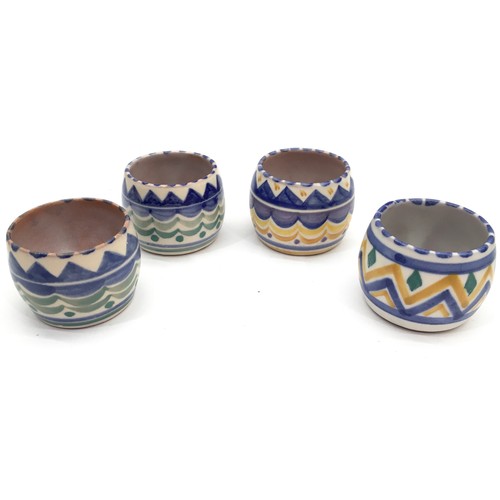 90 - Poole Pottery four geometric design egg cups together with an LD pattern small salt and a Carter Sta... 