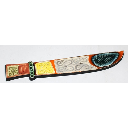 144 - Poole Pottery Dagger wall plaque by Robert Jefferson in unusual colourway, together with a fish plaq... 