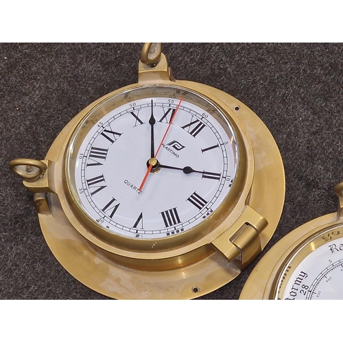 70 - A Plastimo brass bulkhead barometer together with a Plastimo brass bulkhead clock both in the form o... 