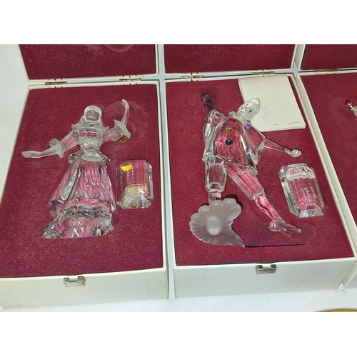 92 - Four boxed Swarovski glass figurines (please examine).