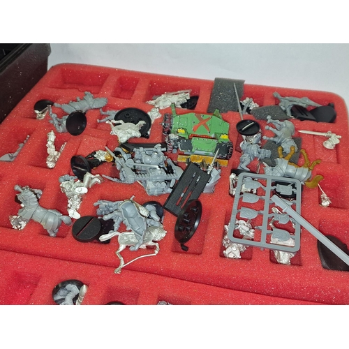 93 - A good collection of Warhammer plastic models together with glues and paints housed in a Games Works... 